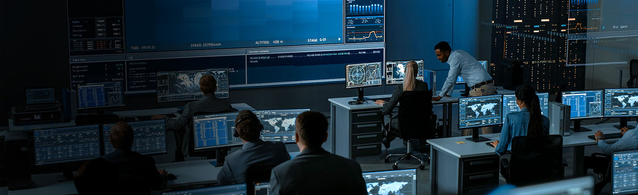 Workers in video management control center