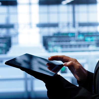 Person using tablet in data center