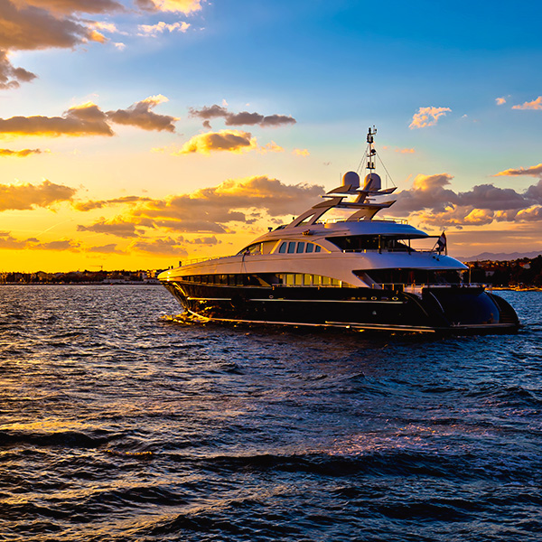 Large boat sailing at sunset