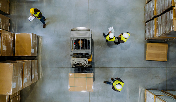 Aerial view of workers in warehouse aisle